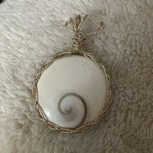 Silver wire wrapped Shiva Eye shell pendant